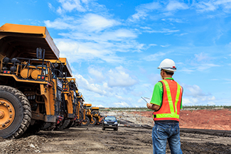 Worker observing mine operations