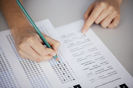 Student bubbling in answers on an Exam